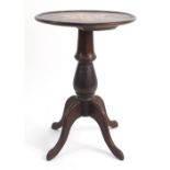 Mahogany occasional table with a star shaped inlaid motif top on a tripod base, 60cm tall