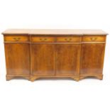 Crossbanded yew breakfront sideboard with four drawers above four cupboard doors, 90cm H x 182cm W x