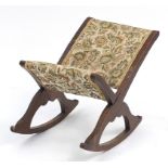 Oak floral upholstered rocking footstool, 60cm high