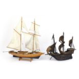 Wooden model of a galleon and wooden yacht with cloth sails, the largest 63cm in length