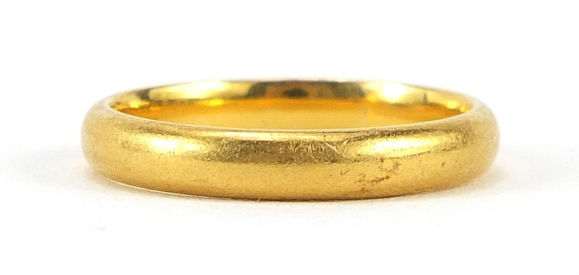 Unmarked gold wedding band (tests as 22ct gold), size N, 4.7g - this lot is sold without buyer's pr