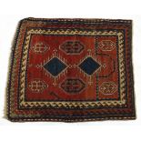 Blue and red ground rug having an all over geometric design, 135cm x 115cm