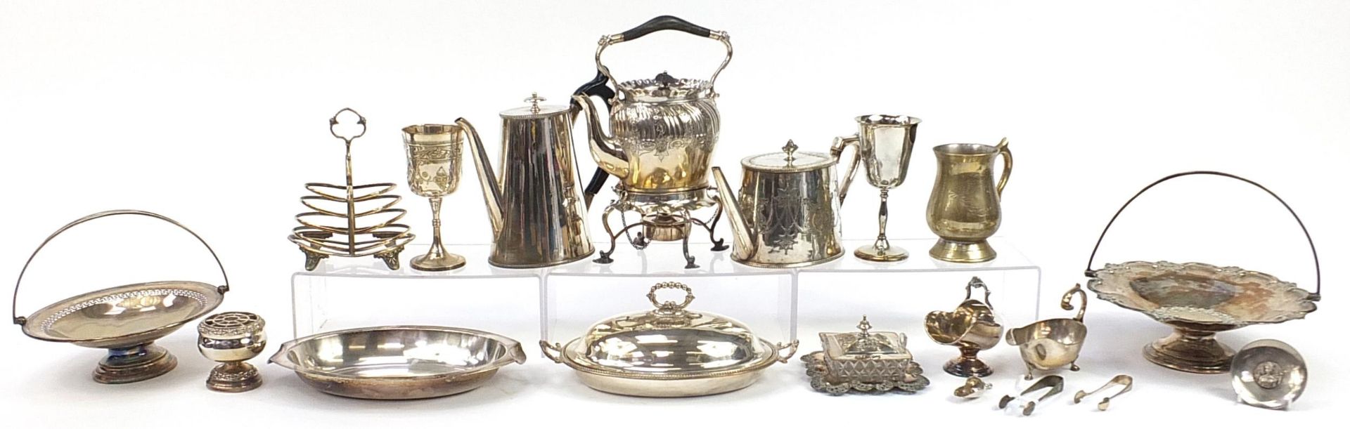 Antique and later silverplate including a Victorian teapot on stand, fruit baskets with swing
