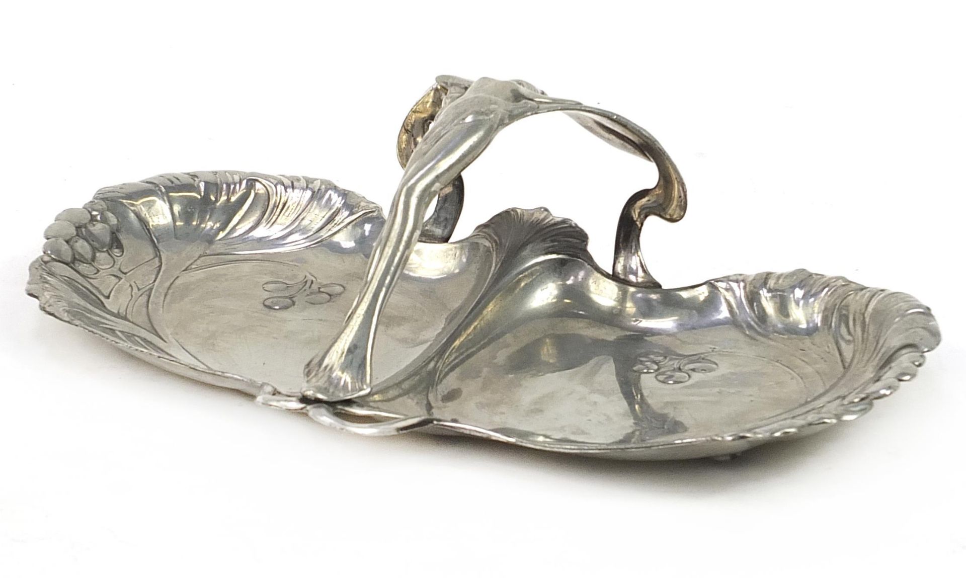 WMF, German Art Nouveau pewter swing meat dish with handle in the form of a nude female, 31cm wide