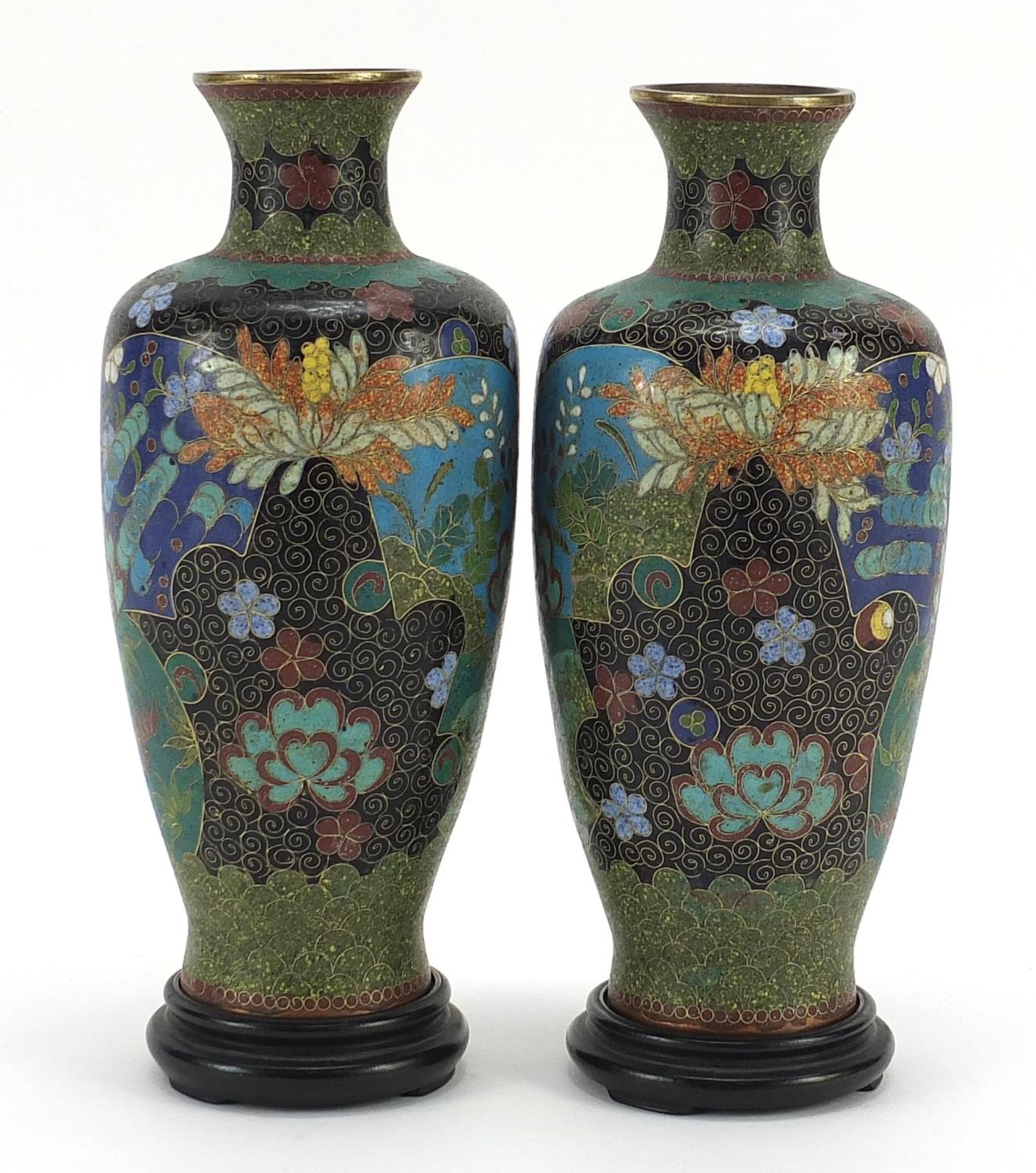 Pair of Japanese cloisonne vases on hardwood stands, each enamelled with flowers within fan