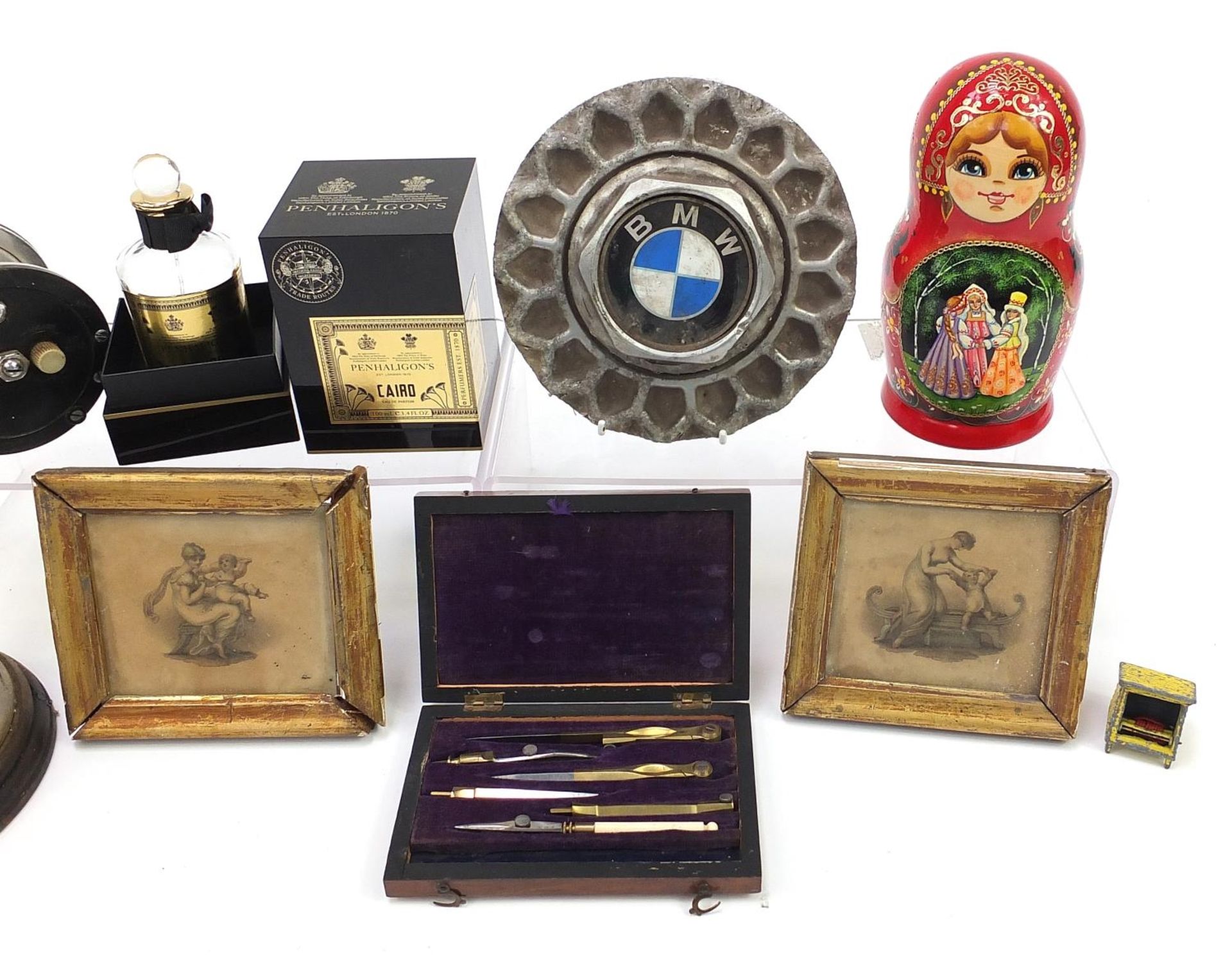 Sundry items including set of Russian stacking dolls, vintage fishing reel and BMW vehicle hub cap - Image 3 of 3