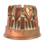 Victorian copper jelly mould numbered 61, 11cm high