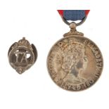 Military interest Elizabeth II Faithful Service medal and TA lapel, the Faithful Service medal