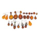 Collection of silver mounted natural amber earrings, the largest 4.5cm high, total weight 57.4g