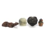 Chinese objects including a carved hardwood water buffalo, bronze mount and green stone weight,