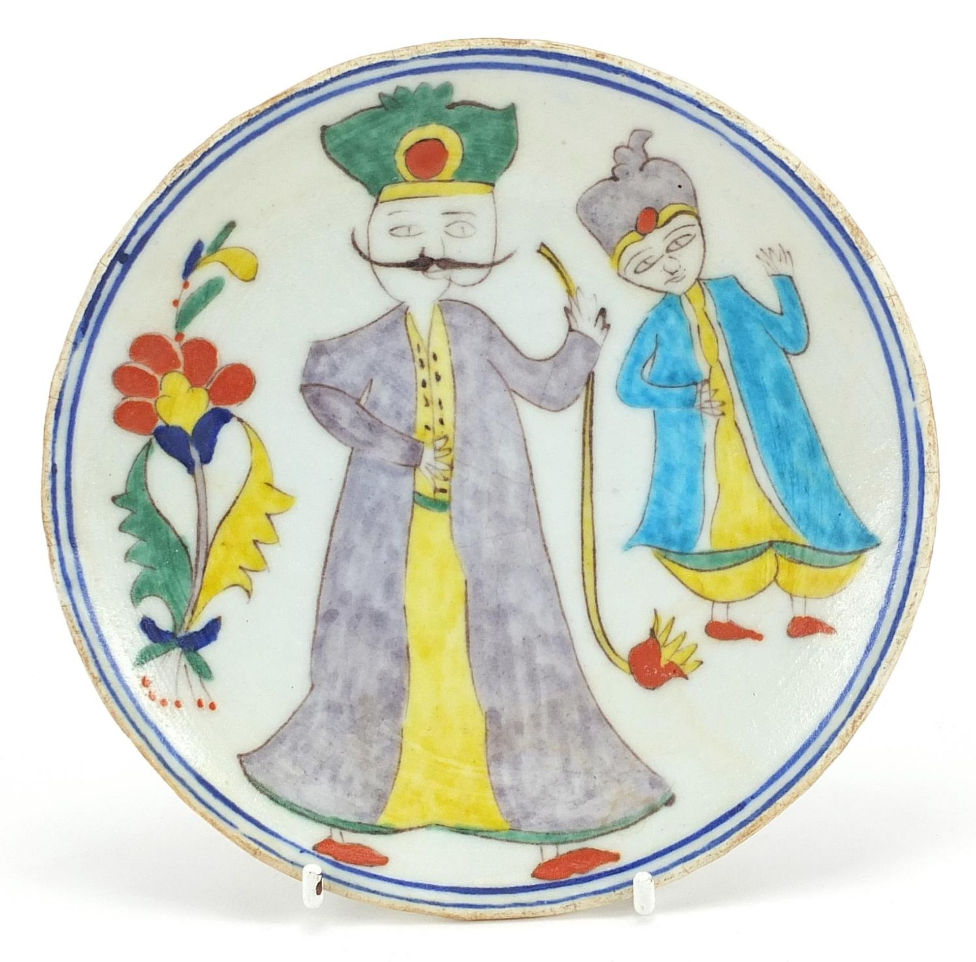 Turkish Kutahya plate hand painted with two figures, 15.5cm in diameter