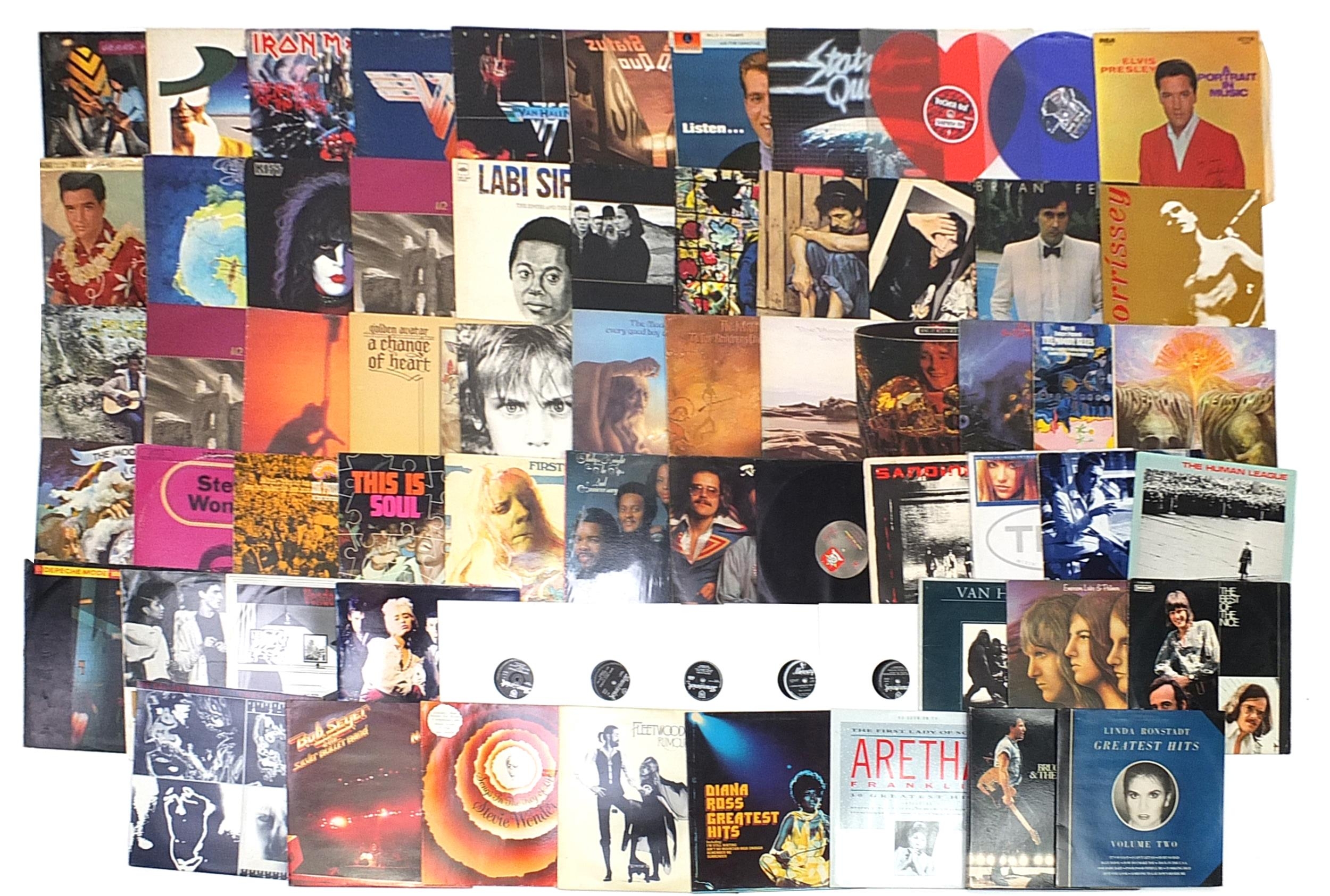 Vinyl LP records including Status Quo, U2, The Moody Blues, Stevie Wonder, The Rolling Stones and