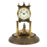 Brass anniversary clock with platform escapement, the movement numbered 21733, 25cm high