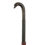 Hardwood walking stick with carved horn dog's head design handle, 88.5cm in length