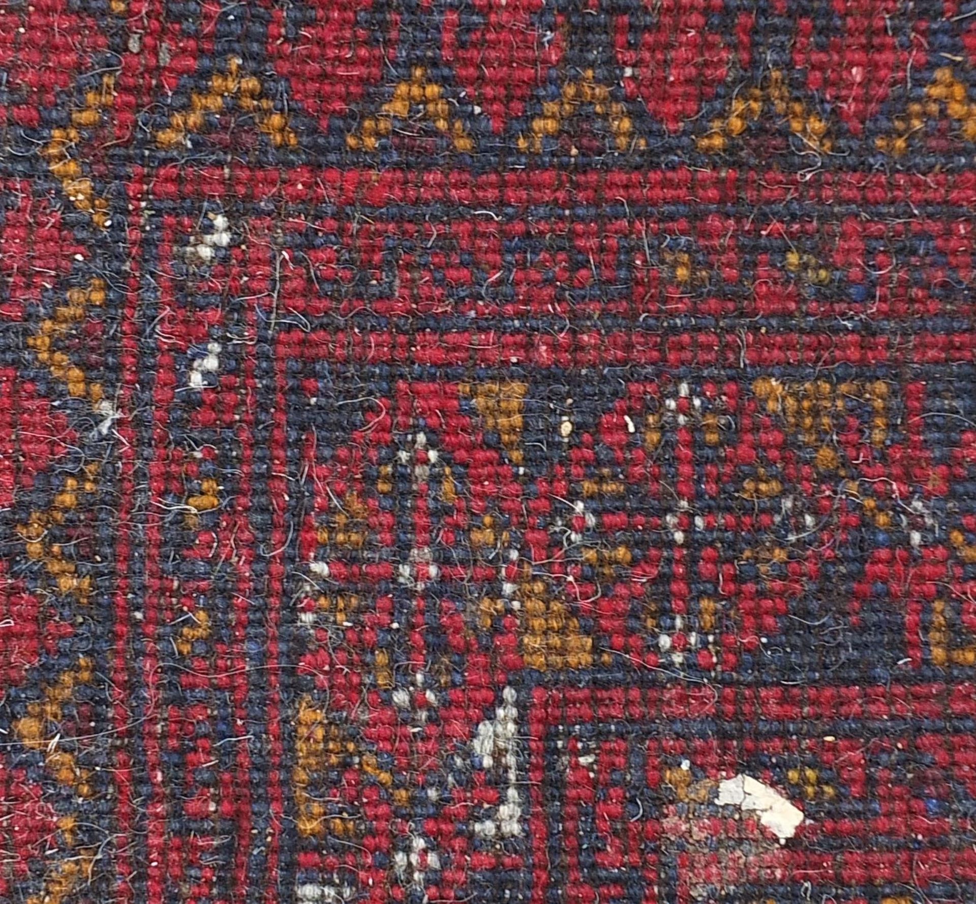 Red ground rug having an all over geometric design, 135cm x 80cm - Bild 3 aus 3