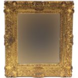 Ornate gilt framed wall mirror, 75cm x 64cm