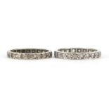 Two unmarked white metal clear stone eternity rings, sizes N and P, 3.9g