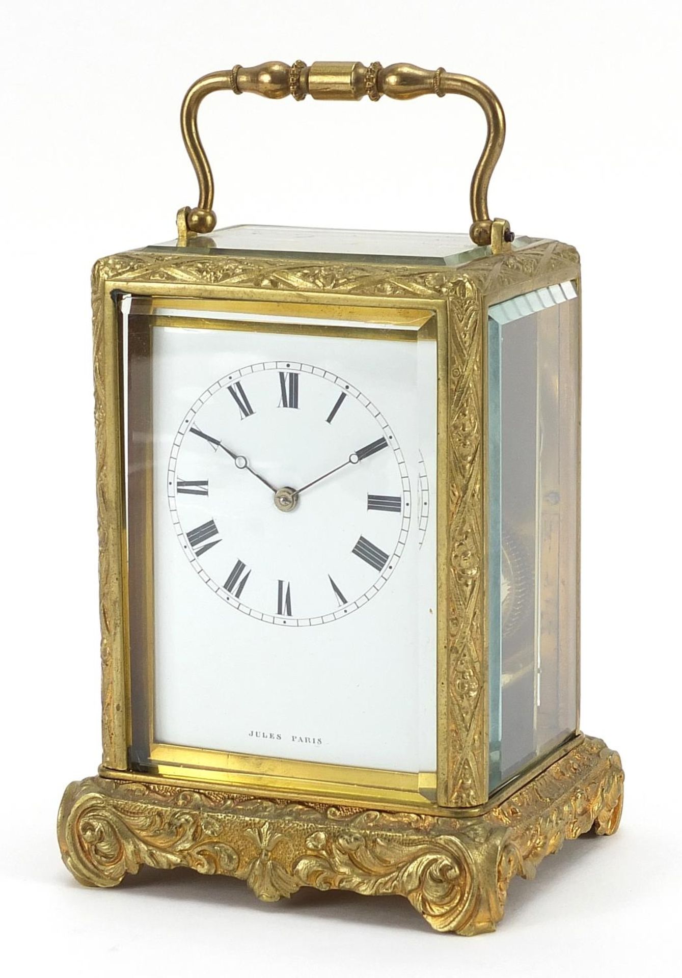 19th century gilt brass cased carriage clock striking on a bell with enamelled dial having Roman