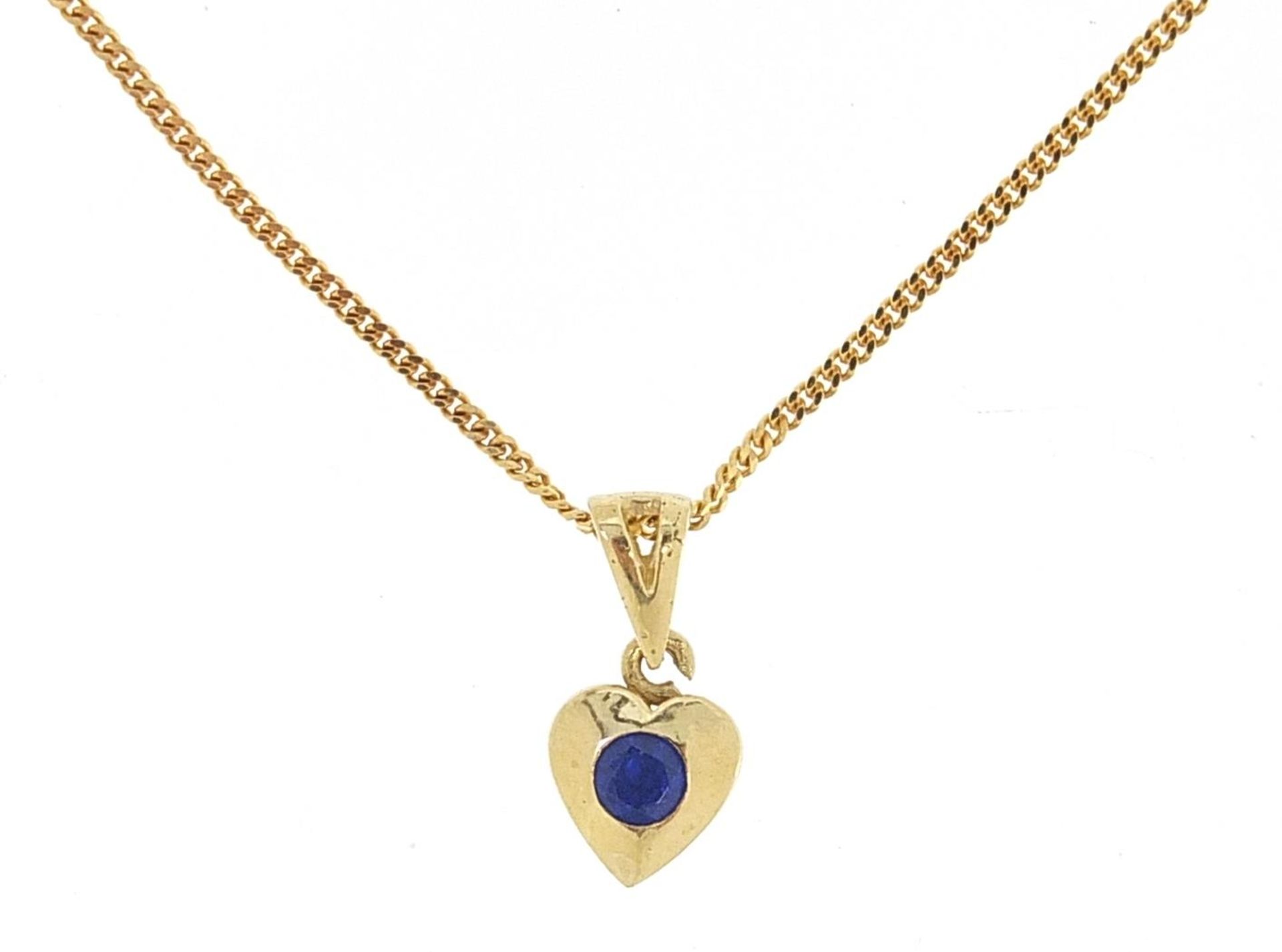 9ct gold necklace with a yellow metal love heart pendant set with a blue stone, 1.4cm high and