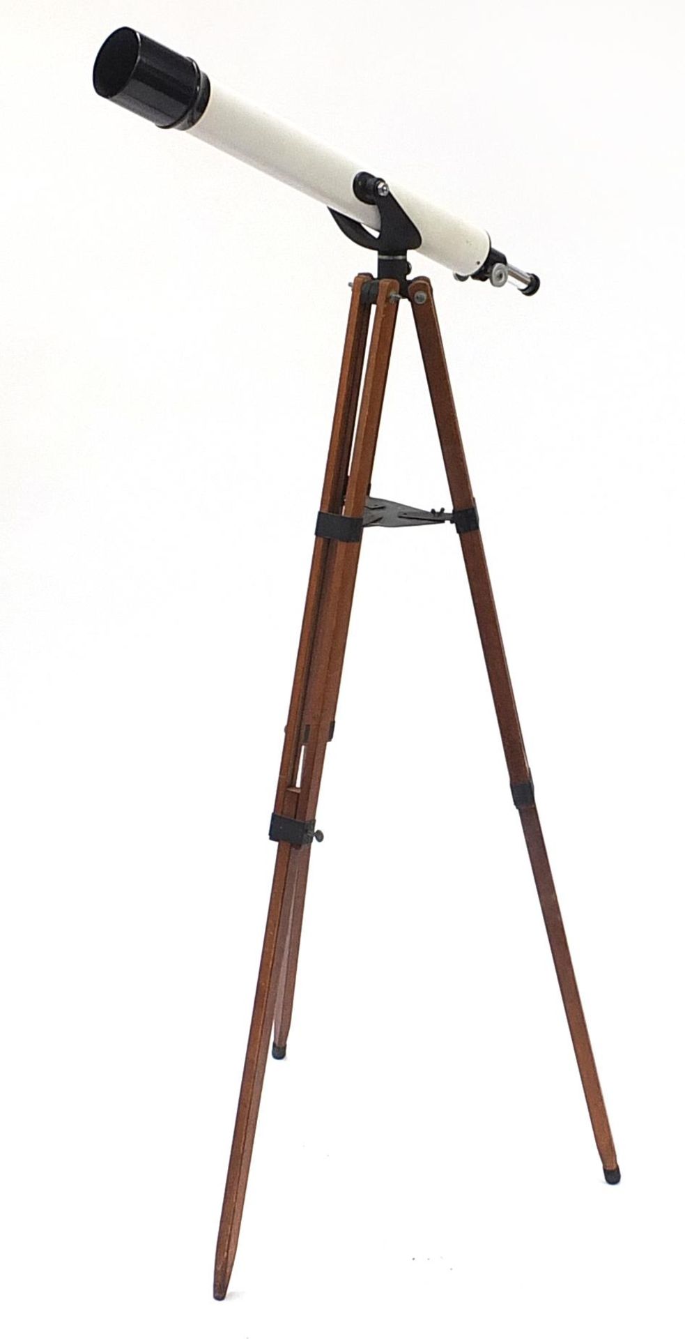Unnamed telescope mounted on a military style adjustable tripod stand