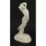Victorian Copeland style parian ware figurine of a nude female holding flowers, 32cm high