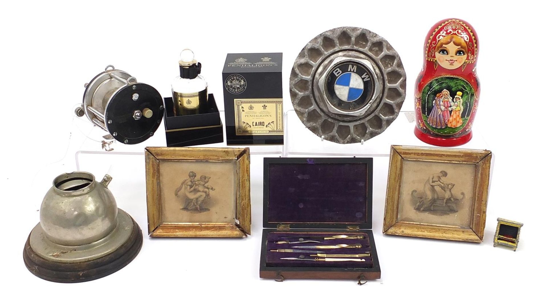 Sundry items including set of Russian stacking dolls, vintage fishing reel and BMW vehicle hub cap