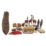 Wooden items including African figures, animals, instruments and large carved wall mask, the largest