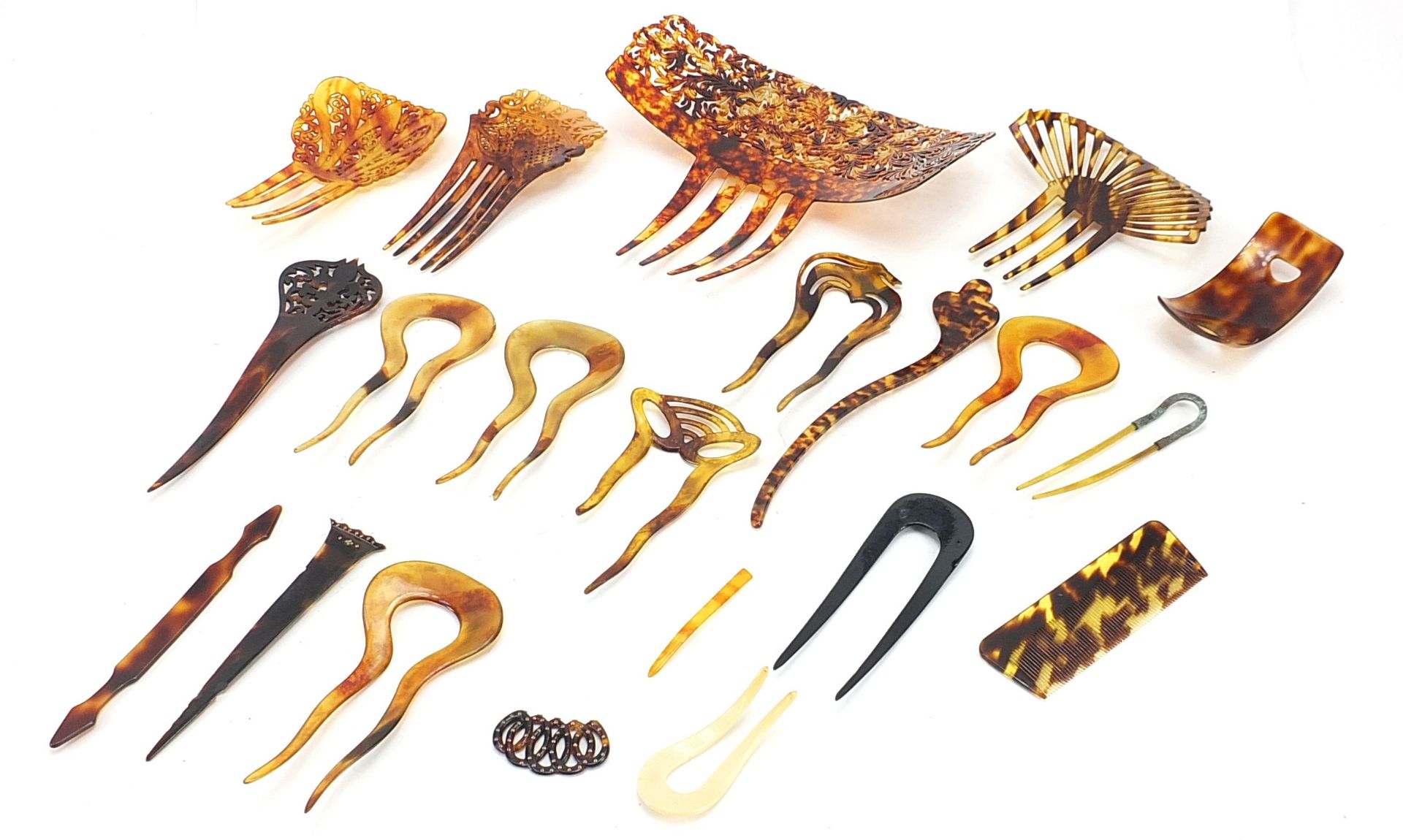 Collection of vintage faux tortoiseshell hair pieces and combs, the largest 19.5cm wide