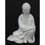 Chinese porcelain figure of Guanyin having a blanc de chine glaze, 12.5cm high