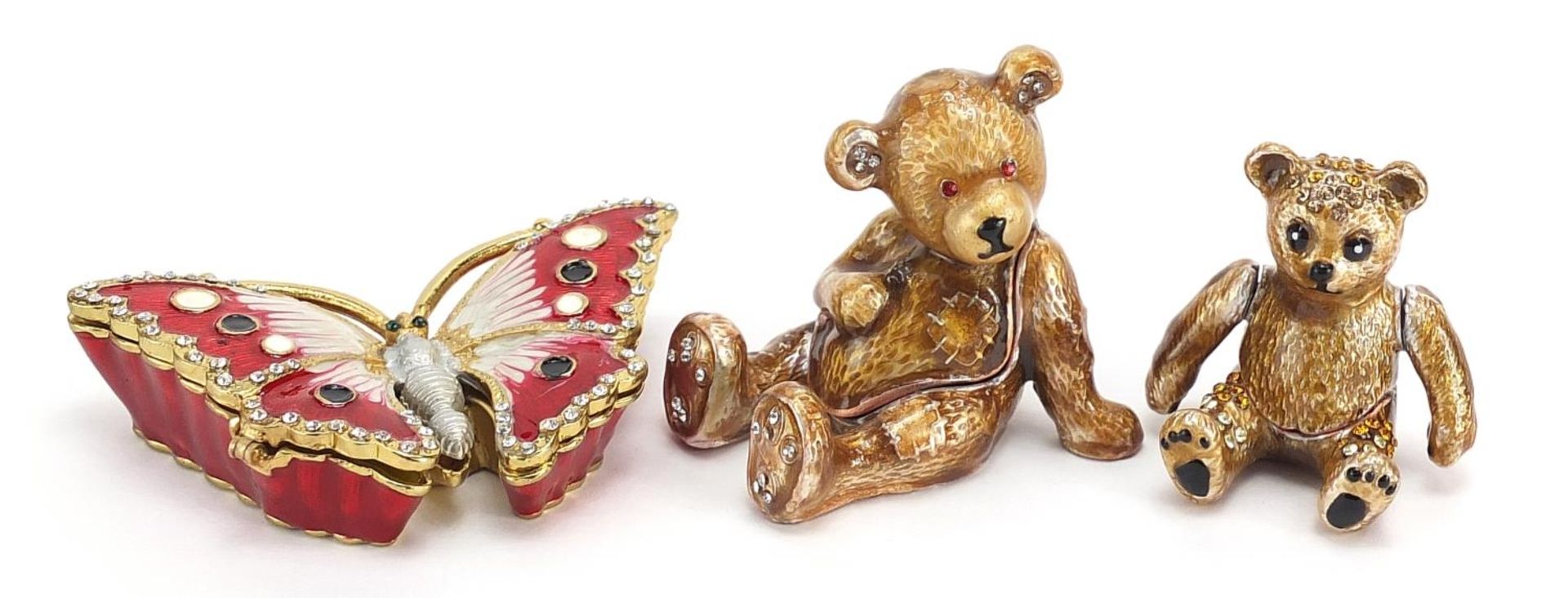 Three jewelled and enamel gilt metal trinkets in the form of teddy bears and a butterfly, the