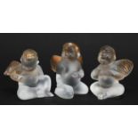 Three frosted and gilt glass angels etched Lalique France, each 8.5cm high