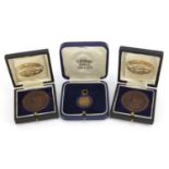 Two London Shipping Athletic Association bronze medals and one other with fitted cases, the two