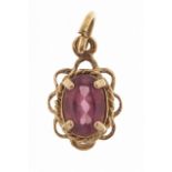 Unmarked 9ct gold pink stone pendant, 1.1cm high, 0.5g