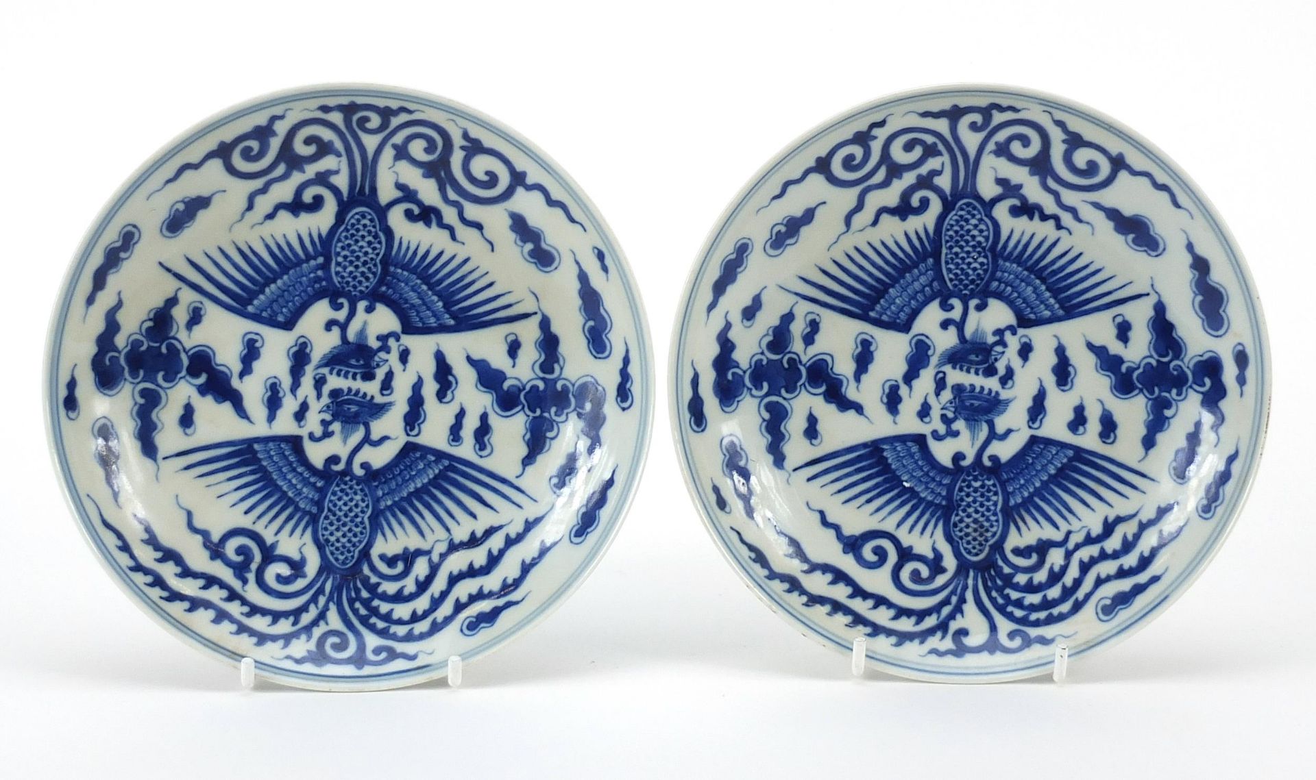 Pair of Chinese blue and white porcelain dishes hand painted with phoenixes amongst clouds, six