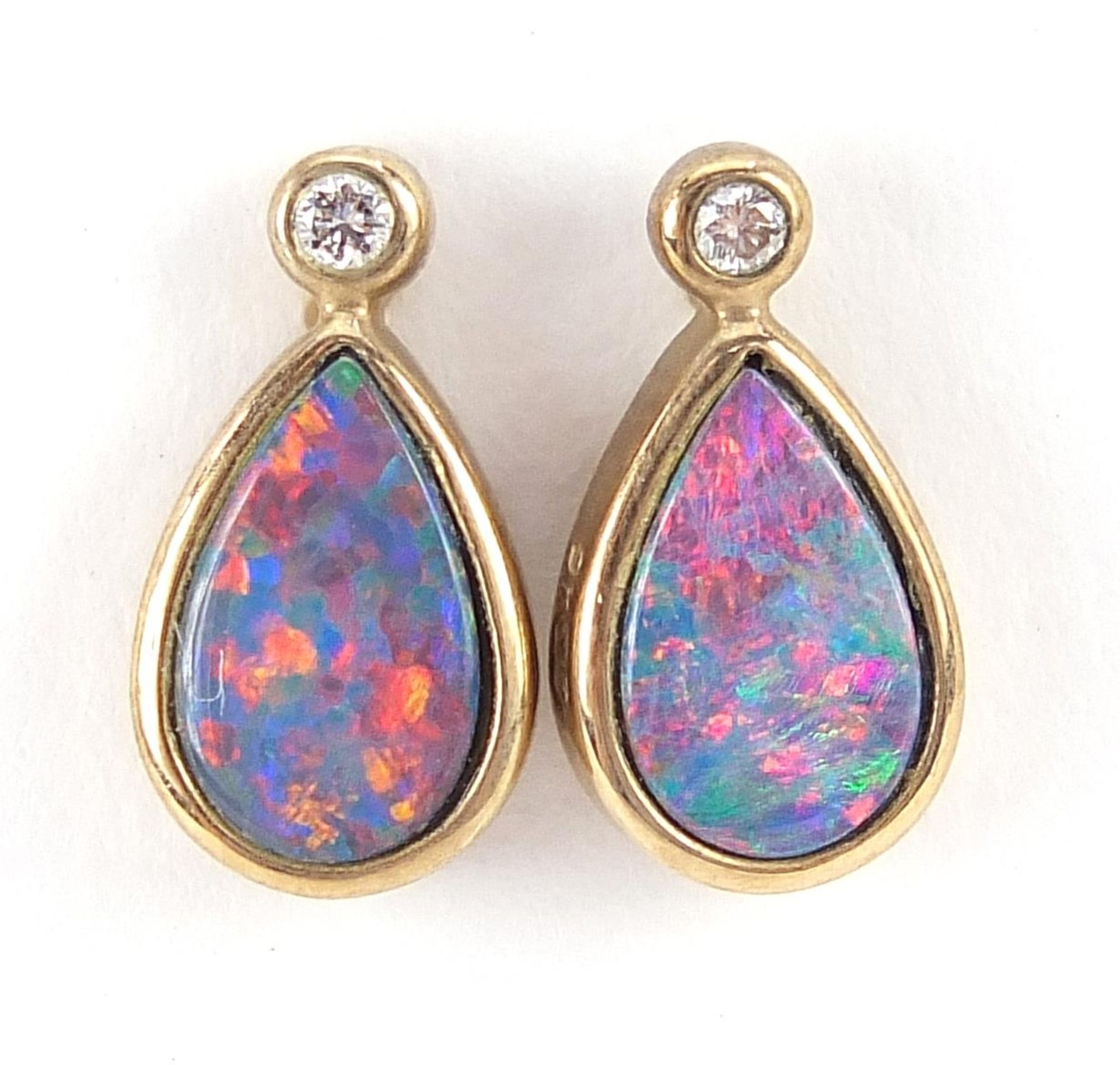 Pair of 9ct gold diamond and opal tear drop stud earrings, 1.2cm high, 1.2g
