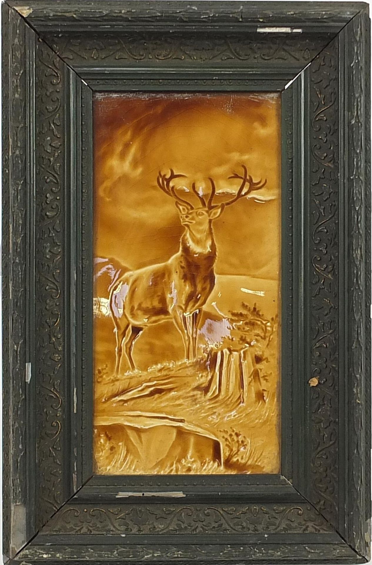 Large Victorian treacle glazed tile hand painted with a stag, framed, the tile 29cm x 14.5cm - Image 2 of 3