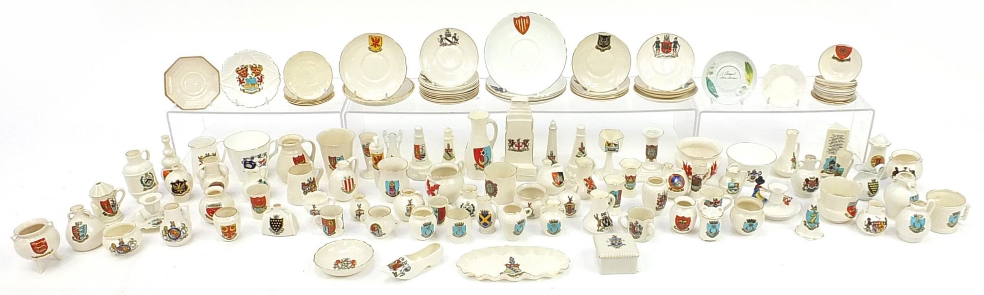 Collection of crested china, some Goss including lighthouses, cauldrons, shoe, cannon and saucers
