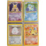 Part set of original Pokemon Base Set trade cards and holographic Flipz cards arranged in albums