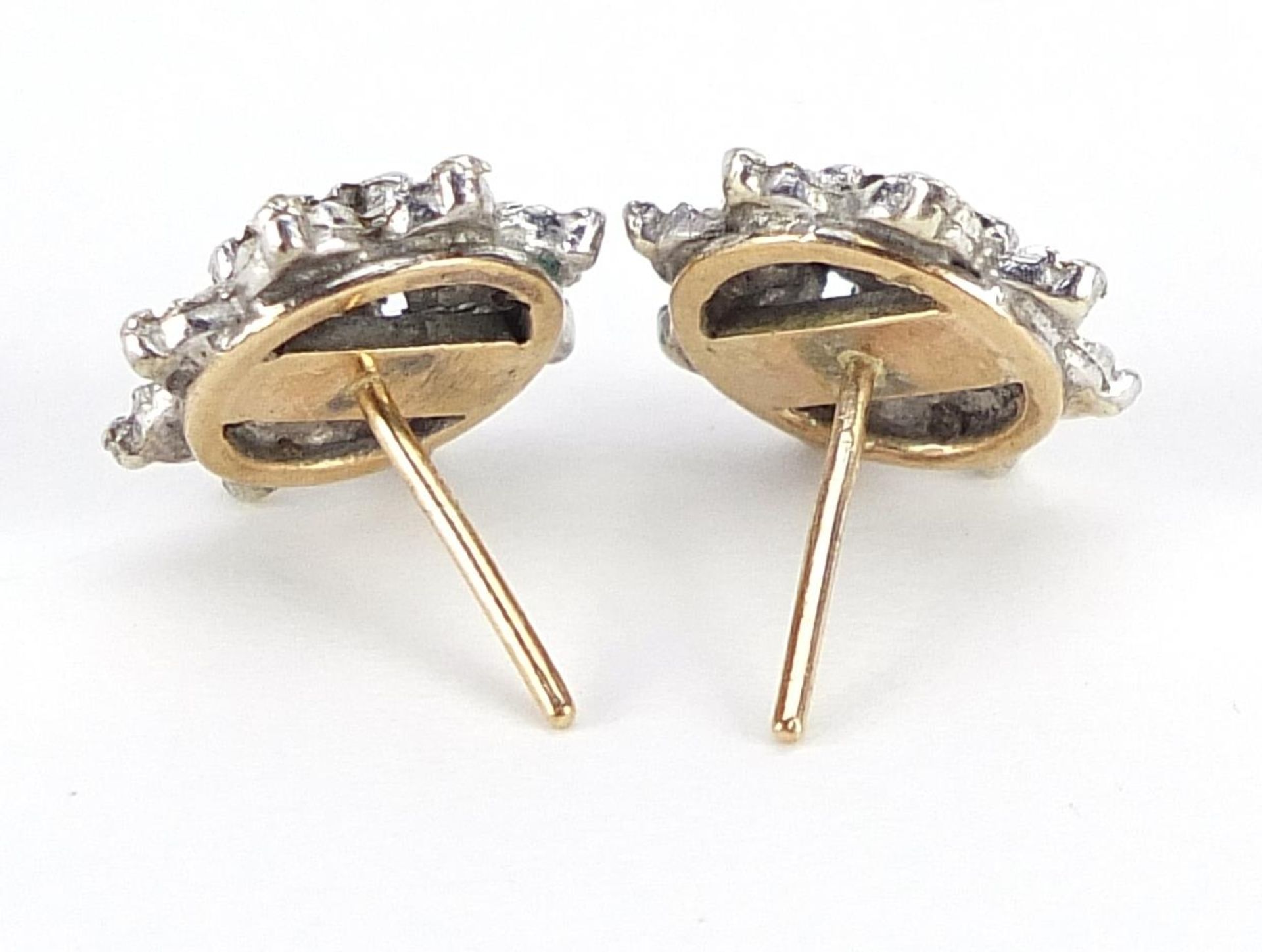 Pair of unmarked two tone gold diamond flower head earrings, 1.2cm in diameter, 3.1g - Image 2 of 2