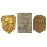 Three German military interest badges, the largest 4.5cm high