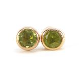 Pair of 9ct gold peridot stud earrings, 5mm in diameter, 0.5g