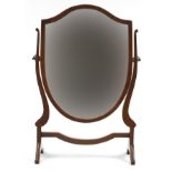 Edwardian mahogany shield shape swing mirror, 59.5cm high