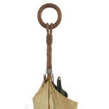 Black forest parasol with carved bamboo design handle, 87cm in length