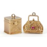 9ct gold first aid box charm and unmarked gold handbag charm set with a white sapphire and ruby, the
