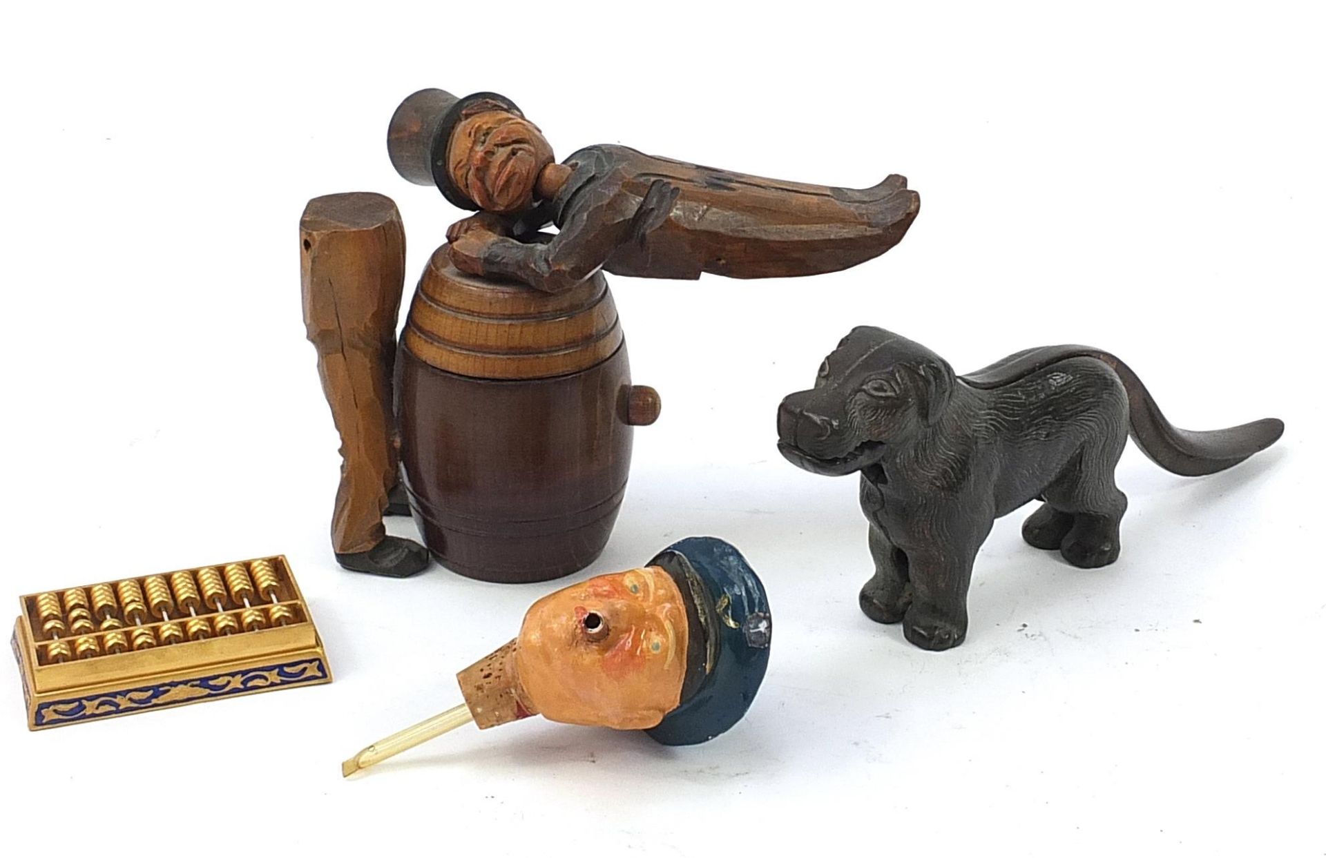 Objects including novelty Black Forest man on a barrel with box and cover, pair of dog nutcrackers