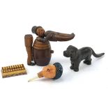 Objects including novelty Black Forest man on a barrel with box and cover, pair of dog nutcrackers