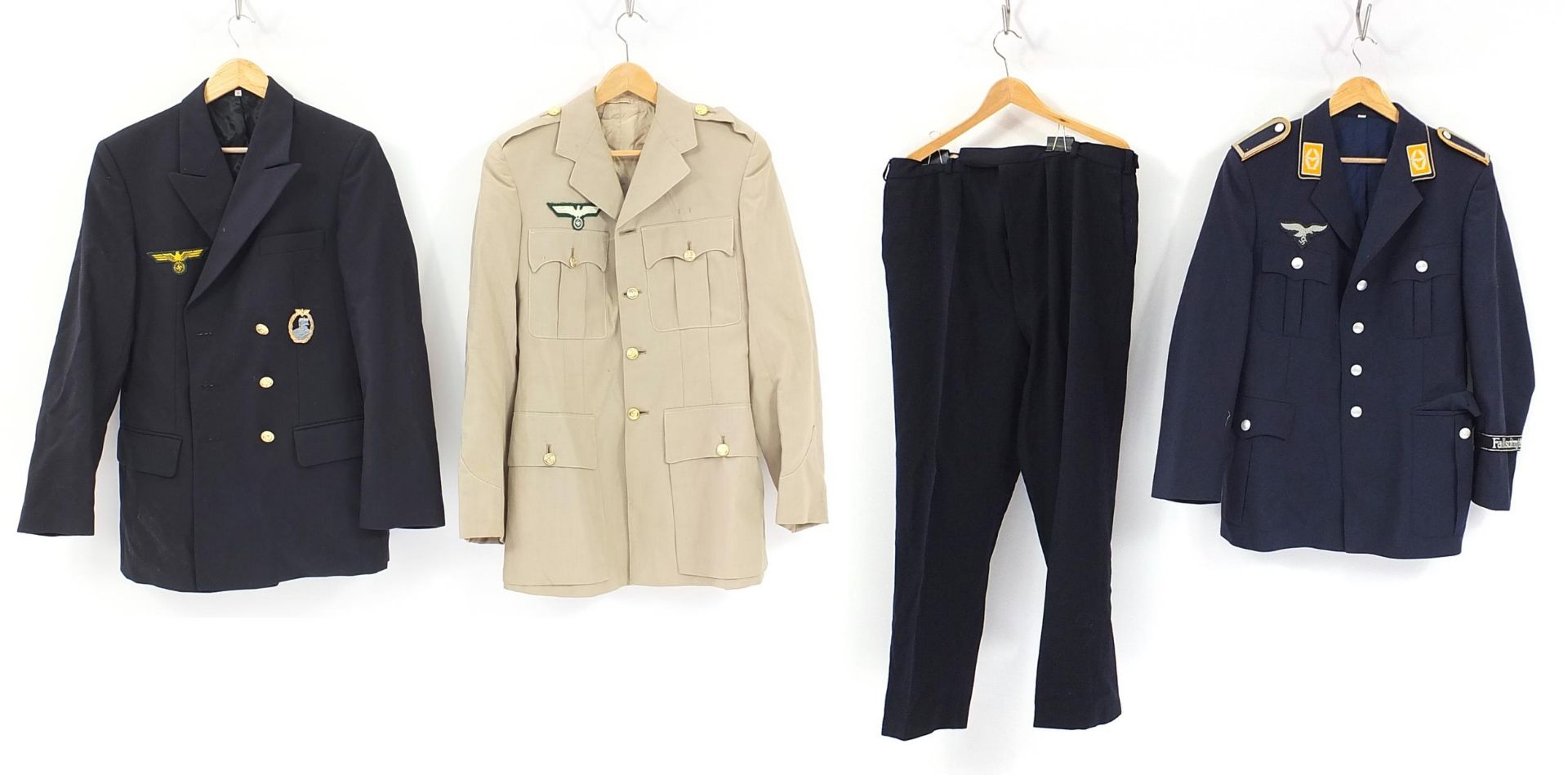 Three German military interest tunics and a pair of trousers