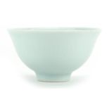 Chinese porcelain tea bowl having a celadon glaze, four figure character marks to the base, 6.5cm in