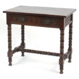 Oak side table with bobbin turned legs, H stretches and frieze drawer carved with Tudor roses,