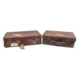 Two vintage brown leather suitcases with Cunard White Line shipping labels, the largest 71cm wide